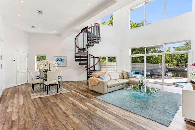 5533 Rico Dr, Boca Raton, FL 33487 - living area featuring a high ceiling, stairway, wood finished floors, recessed lighting, and baseboards