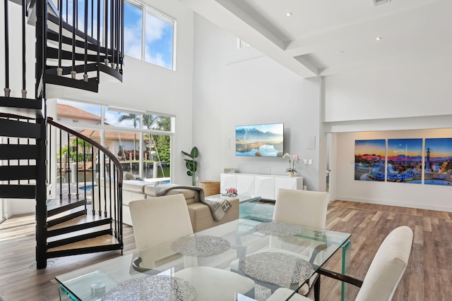 5533 Rico Dr, Boca Raton, FL 33487 - dining area with a high ceiling, stairway, wood finished floors, beam ceiling, and recessed lighting