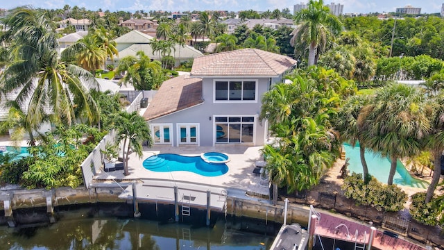 5533 Rico Dr, Boca Raton, FL 33487 - back of house featuring a tiled roof, stucco siding, a fenced backyard, and a patio