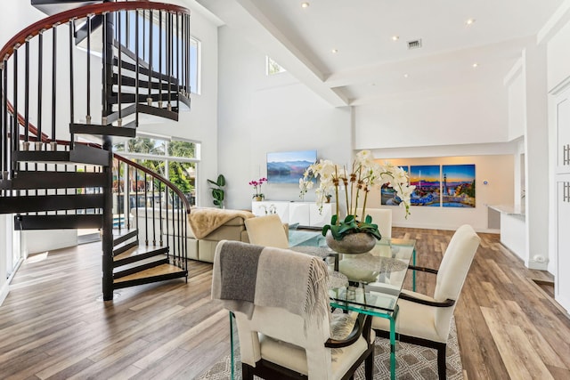 5533 Rico Dr, Boca Raton, FL 33487 - dining room with wood finished floors, stairs, recessed lighting, and a towering ceiling