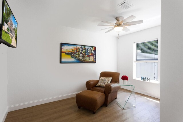 5533 Rico Dr, Boca Raton, FL 33487 - sitting room with wood finished floors, ceiling fan, and baseboards