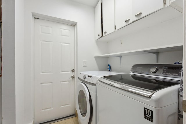 5533 Rico Dr, Boca Raton, FL 33487 - laundry room with cabinet space and washer and clothes dryer