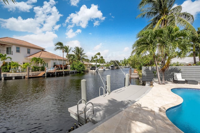 5533 Rico Dr, Boca Raton, FL 33487 - outdoor pool featuring a water view and a dock