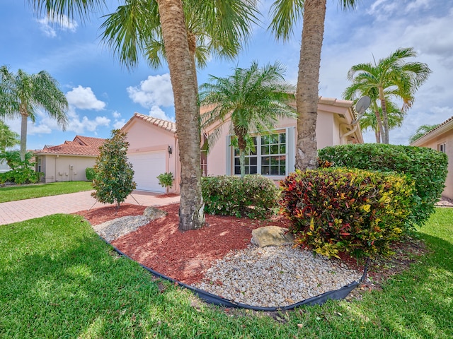 mediterranean / spanish-style home featuring a garage