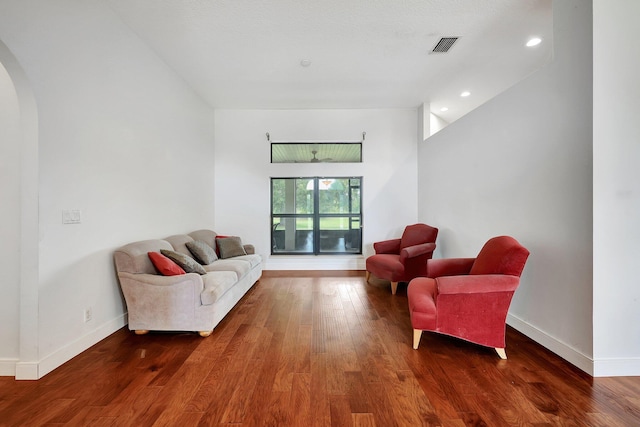 5890 NE 56th Pkwy, Okeechobee, FL 34972 - living room with visible vents, baseboards, arched walkways, recessed lighting, and wood finished floors