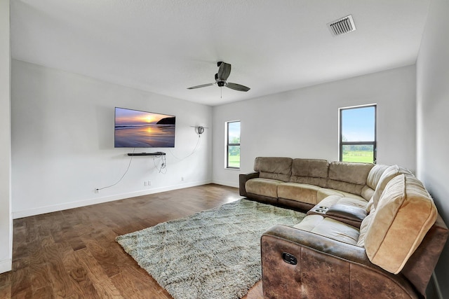 5890 NE 56th Pkwy, Okeechobee, FL 34972 - living room featuring wood finished floors, ceiling fan, baseboards, and visible vents
