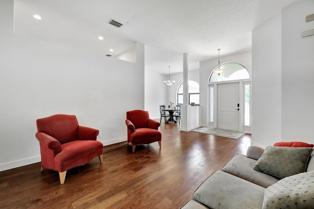 5890 NE 56th Pkwy, Okeechobee, FL 34972 - living area with visible vents, baseboards, a chandelier, recessed lighting, and wood finished floors