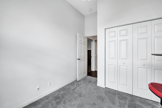 5890 NE 56th Pkwy, Okeechobee, FL 34972 - unfurnished bedroom featuring a closet, baseboards, and carpet floors