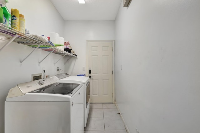 5890 NE 56th Pkwy, Okeechobee, FL 34972 - washroom with independent washer and dryer, laundry area, and light tile patterned flooring