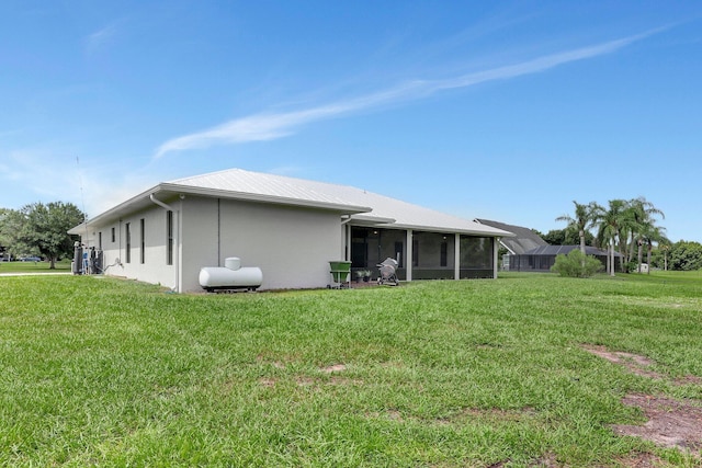 5890 NE 56th Pkwy, Okeechobee, FL 34972 - back of property with a yard and stucco siding