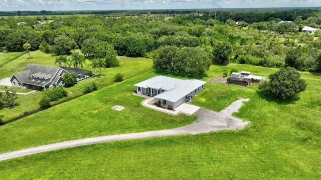 5890 NE 56th Pkwy, Okeechobee, FL 34972 - birds eye view of property with a wooded view