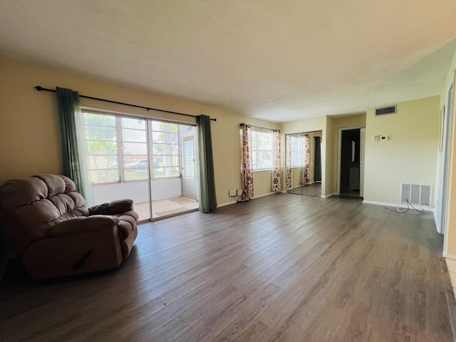 145 Lake Evelyn Dr, West Palm Beach, FL 33411 - living room featuring wood finished floors, visible vents, and baseboards
