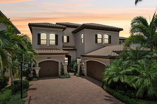 mediterranean / spanish-style house featuring a garage