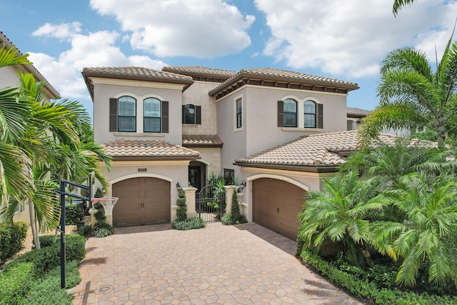 mediterranean / spanish house featuring a garage