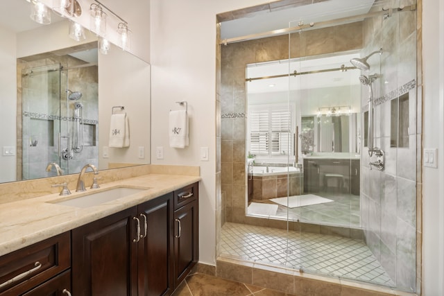 bathroom featuring vanity, tile patterned floors, and a shower with door