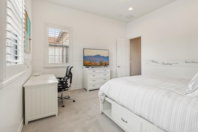 bedroom featuring light colored carpet