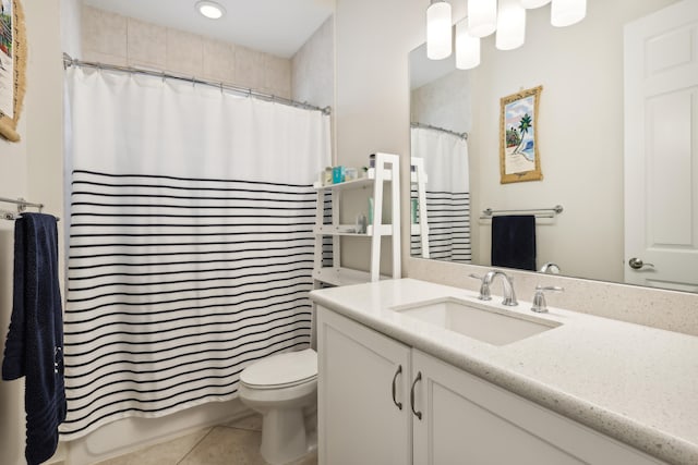 bathroom with vanity, tile patterned flooring, and toilet