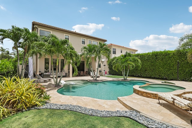 view of pool with an in ground hot tub and a patio area