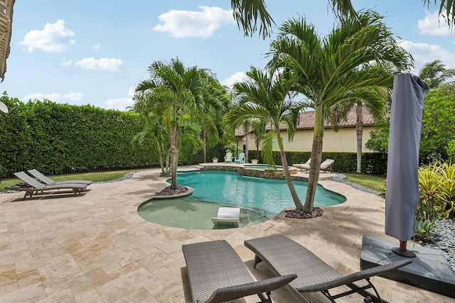 view of swimming pool featuring a patio area