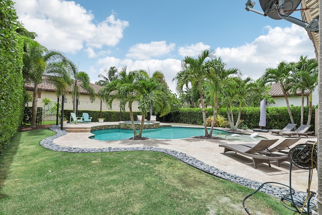 view of swimming pool with a patio area and a lawn