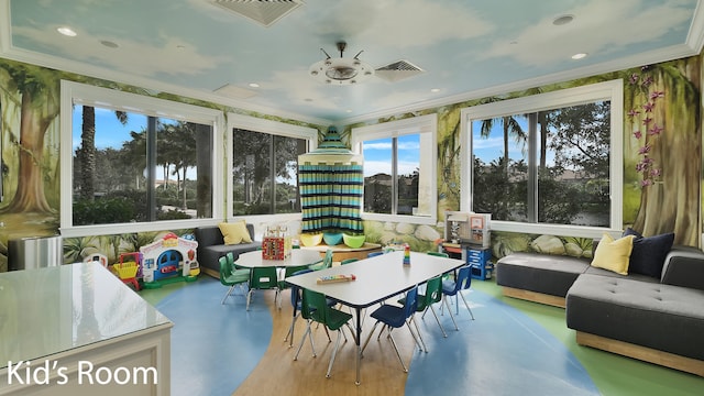 sunroom featuring a wealth of natural light and ceiling fan