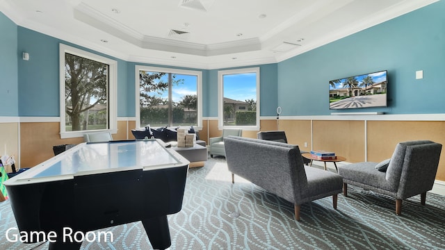 office space with ornamental molding, a wealth of natural light, and a tray ceiling