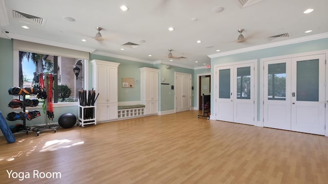 workout room featuring ceiling fan, french doors, light hardwood / wood-style flooring, and ornamental molding