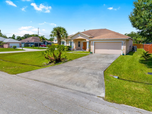 ranch-style house featuring a garage and a front lawn