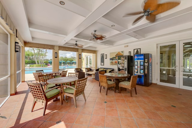 sunroom with beamed ceiling, french doors, ceiling fan, and coffered ceiling