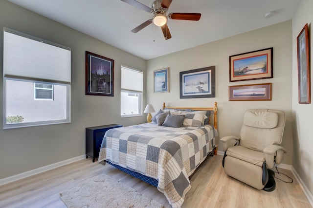 bedroom featuring light wood-type flooring and ceiling fan