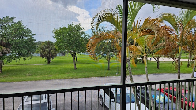 view of yard featuring a balcony