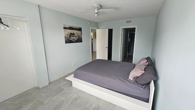 unfurnished bedroom with a textured ceiling and ceiling fan