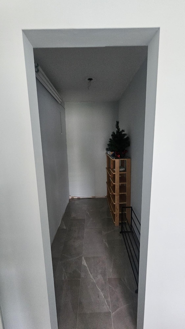 corridor with marble finish floor