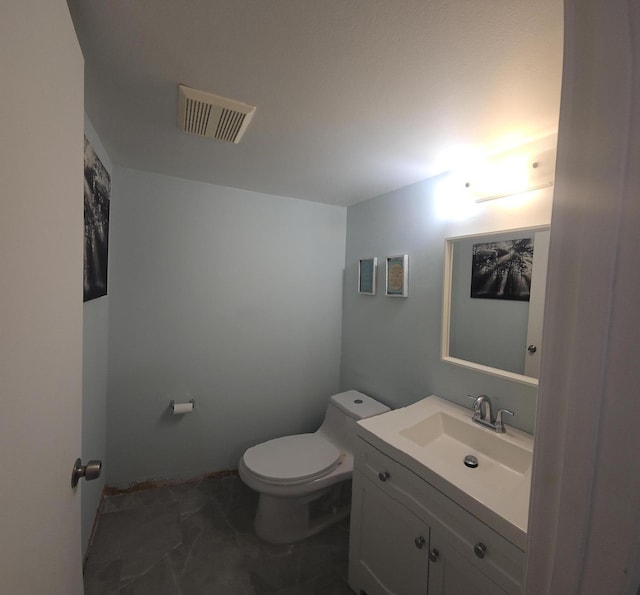 bathroom featuring marble finish floor, visible vents, toilet, and vanity