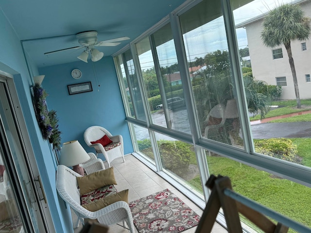 sunroom with ceiling fan and plenty of natural light