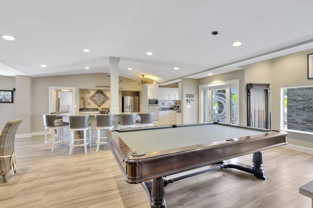 rec room featuring vaulted ceiling, light hardwood / wood-style floors, and pool table