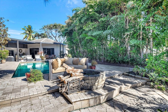 view of pool featuring an outdoor living space and a patio