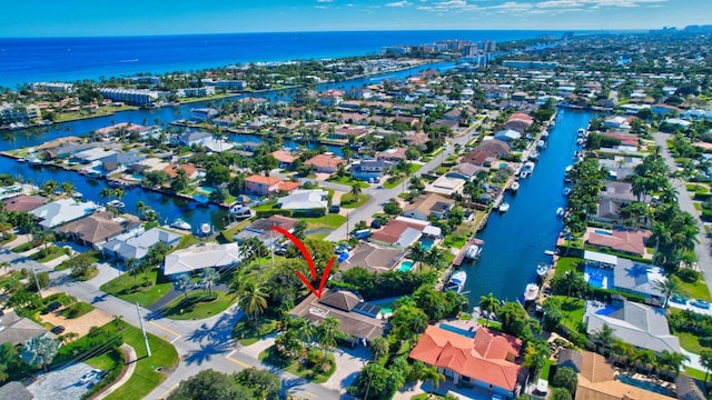 birds eye view of property featuring a water view