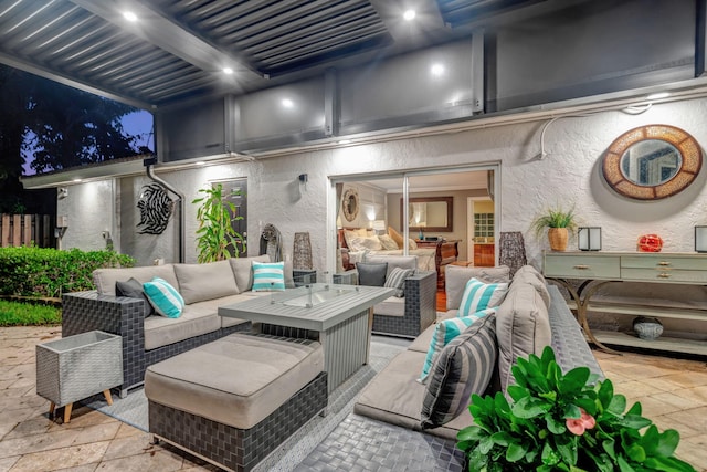 patio at twilight with an outdoor hangout area