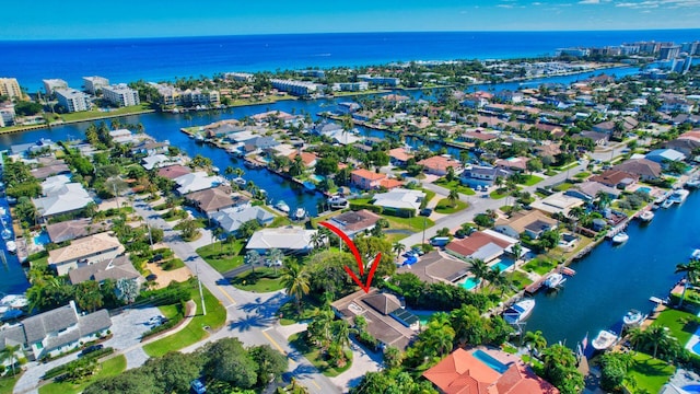 birds eye view of property featuring a water view