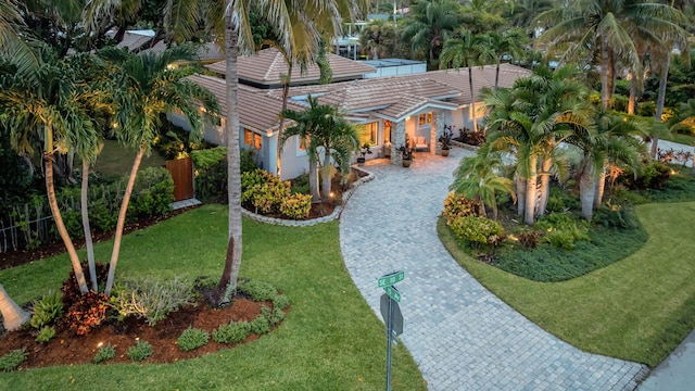 mediterranean / spanish house featuring a front yard