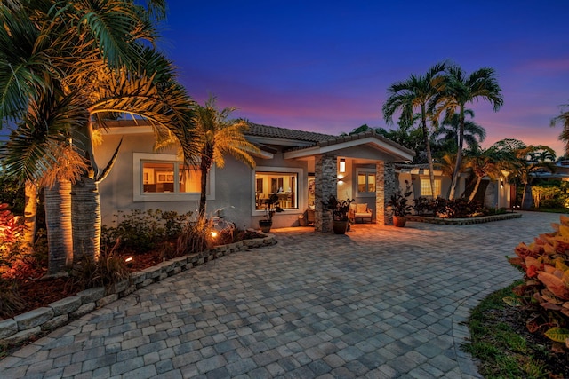 mediterranean / spanish home featuring a patio area