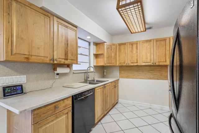 kitchen with light tile patterned flooring, backsplash, black appliances, and sink