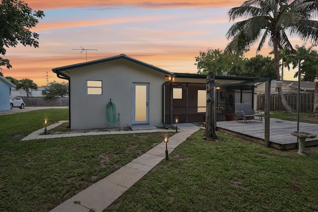 exterior space with a yard and a wooden deck