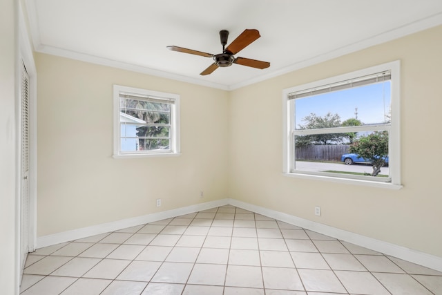 empty room with ornamental molding, a wealth of natural light, and ceiling fan