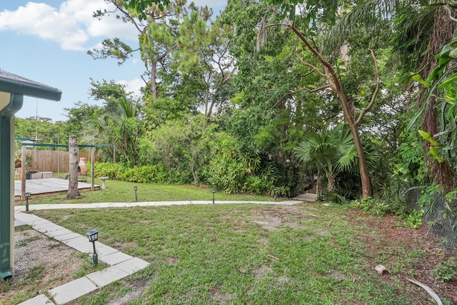 view of yard with a wooden deck