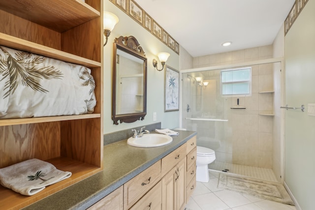 bathroom featuring vanity, toilet, tile patterned floors, and a shower with door