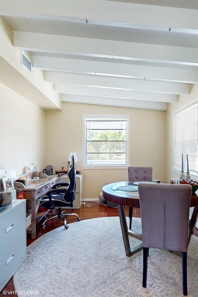 office area with hardwood / wood-style flooring and lofted ceiling with beams