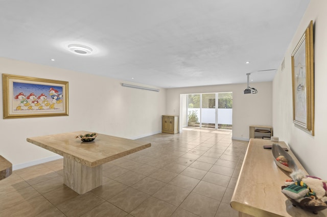 interior space with tile patterned flooring, visible vents, and baseboards