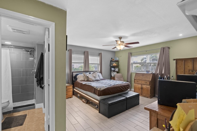 bedroom with multiple windows and a ceiling fan